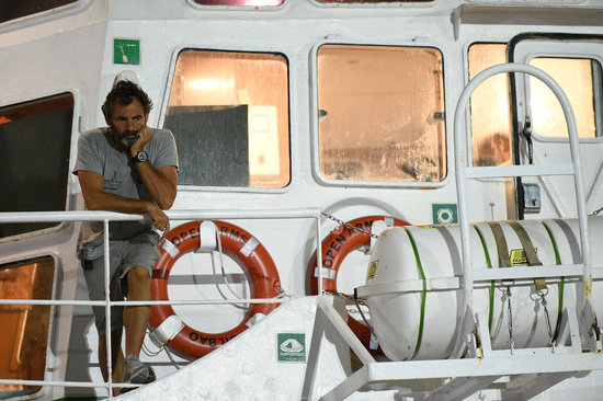 Open Arms founder Òscar Camps aboard the ship as it remains docked in Lampedusa (Reuters)